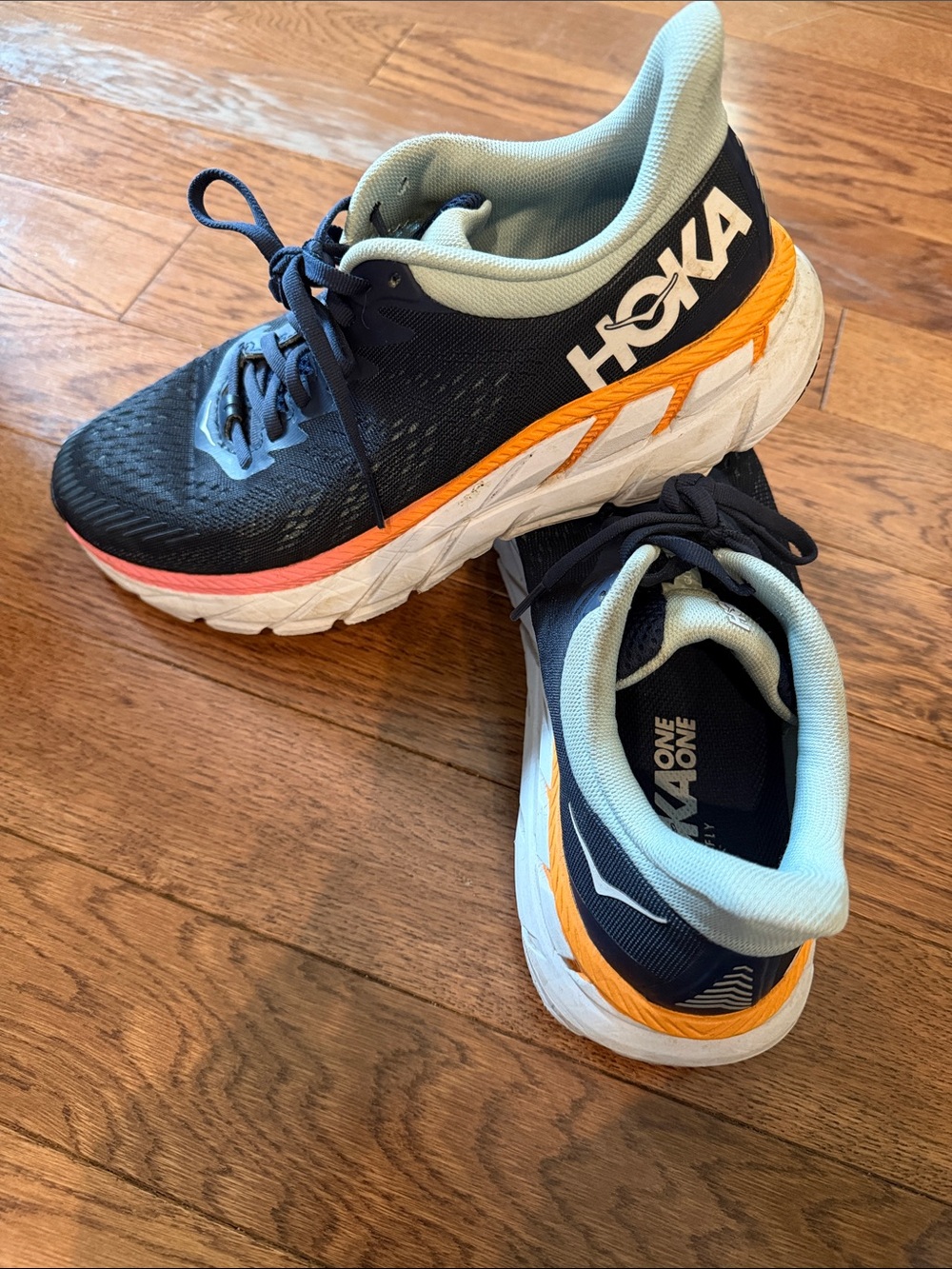 HOKA womens Navy with Orange Clifton 7 Sneakers size 9